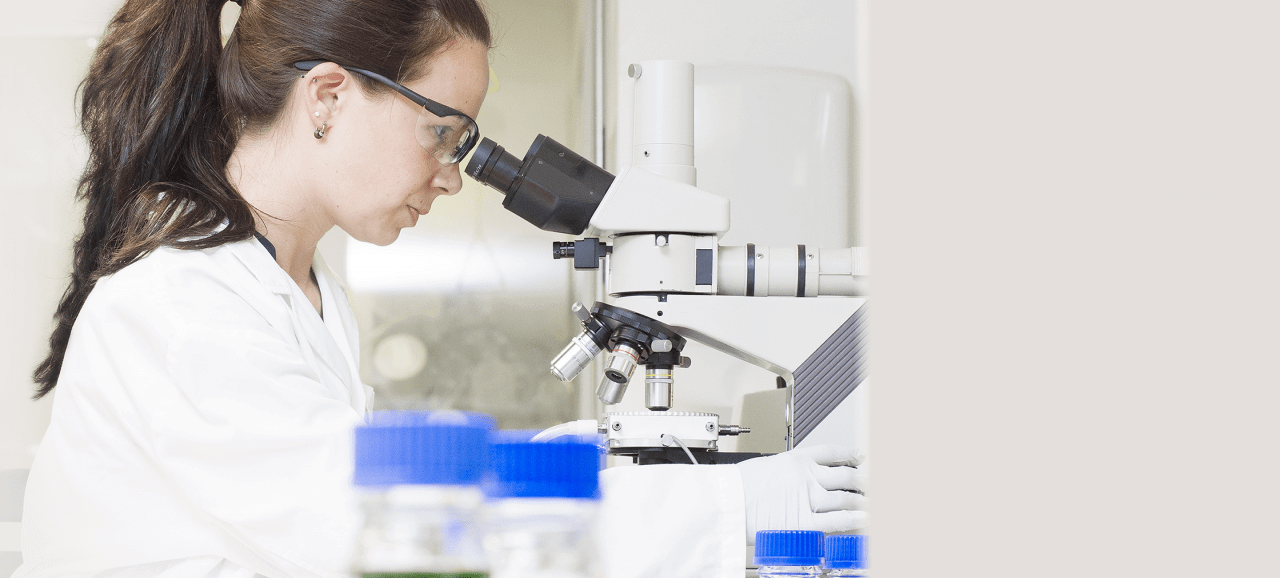 scientist working with a microscope - Hovione